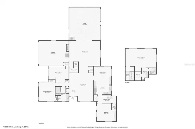 an aerial view of residential houses with outdoor space and lake view