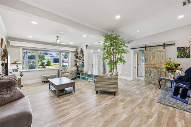 a living room with furniture and a large window