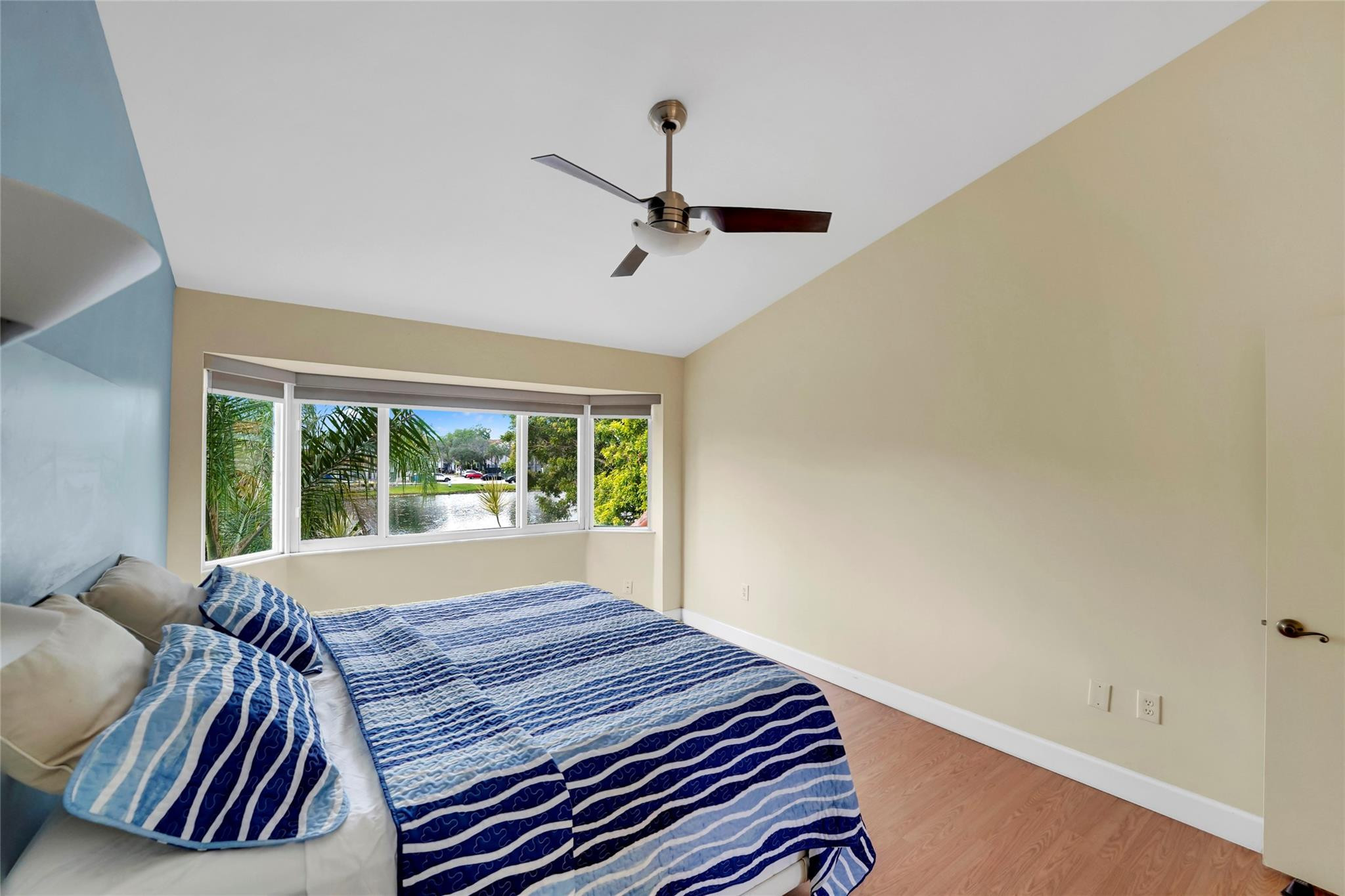 3130 North 38th Avenue Hollywood, FL 33021 - Photo 17 of 42 a bed sitting in a bedroom next to a window