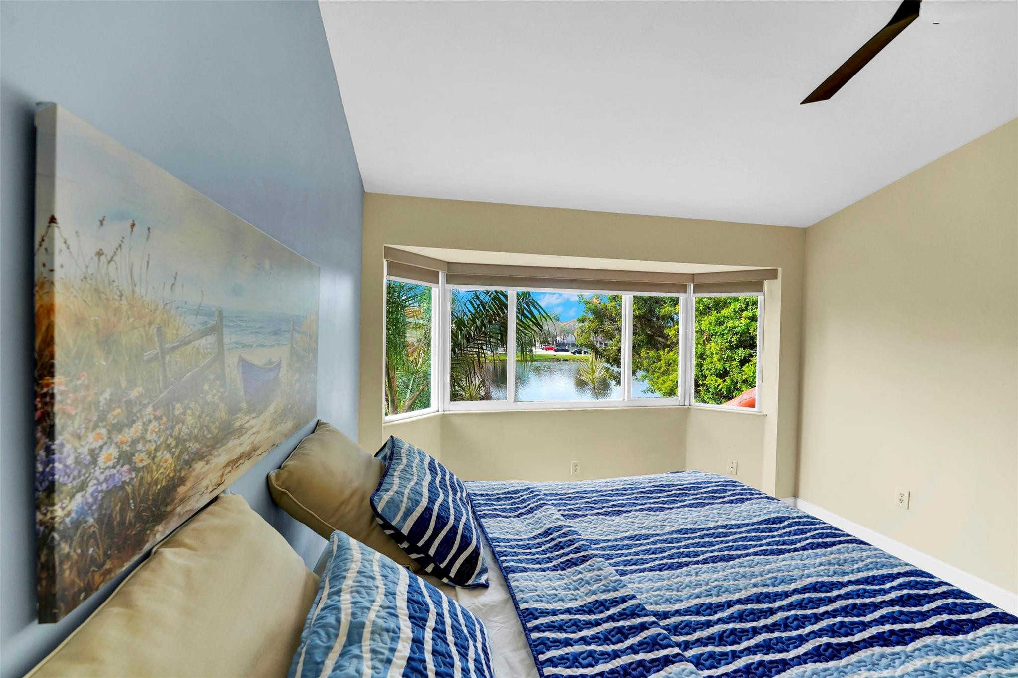 3130 North 38th Avenue Hollywood, FL 33021 - Photo 18 of 42 a bed sitting in a bedroom next to a window