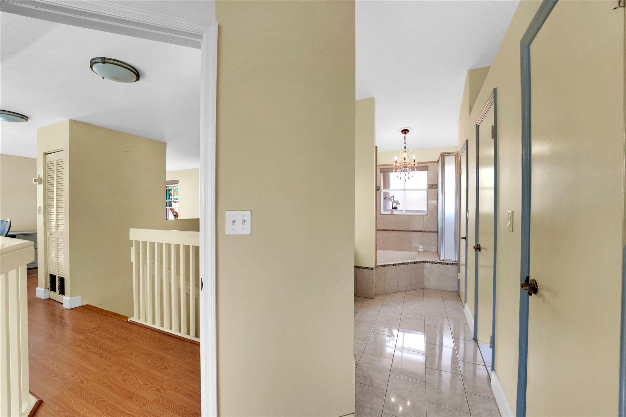 3130 North 38th Avenue Hollywood, FL 33021 - Photo 23 of 42 a view of a hallway with wooden floor and a bathroom