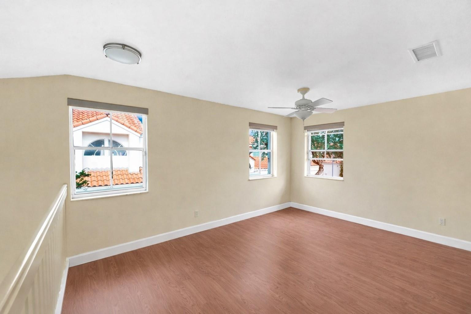 3130 North 38th Avenue Hollywood, FL 33021 - Photo 25 of 42 wooden floor in an empty room with a window