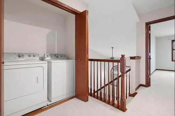 a view of storage and utility room with washer and dryer