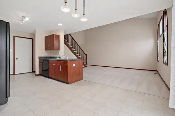 a view of kitchen with stainless steel appliances cabinets