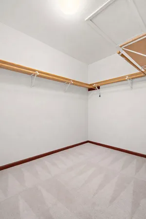 a view of a room with an empty space and a floor to ceiling window