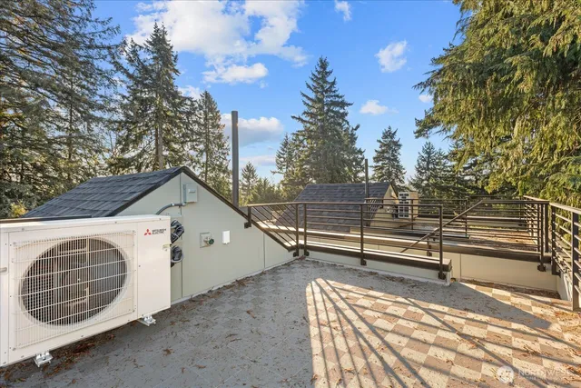 a view of outdoor space with porch and wooden fence