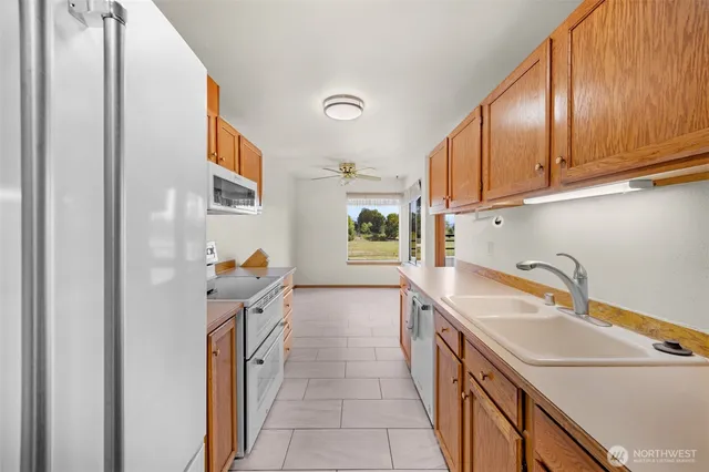 a kitchen that has a sink and a stove