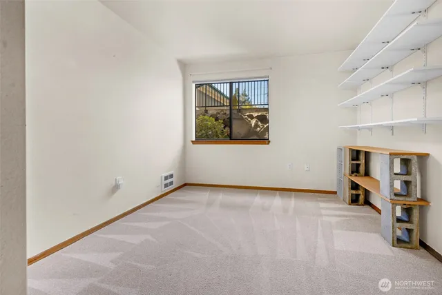 a bathroom with a glass shower door