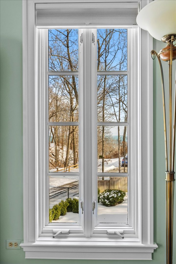 697 Bluff Road Lake Bluff, IL 60044 - Photo 23 of 49 a view of a wooden floor and a red door