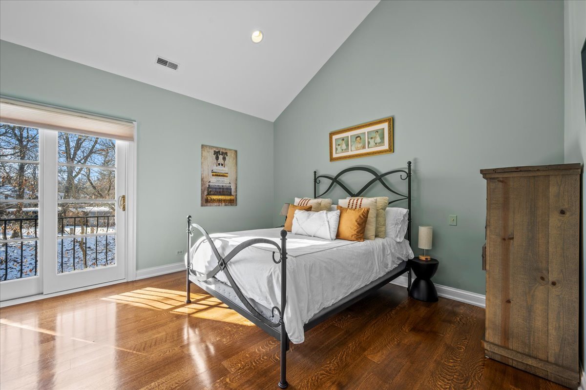 697 Bluff Road Lake Bluff, IL 60044 - Photo 27 of 49 a bedroom with a bed and glass door