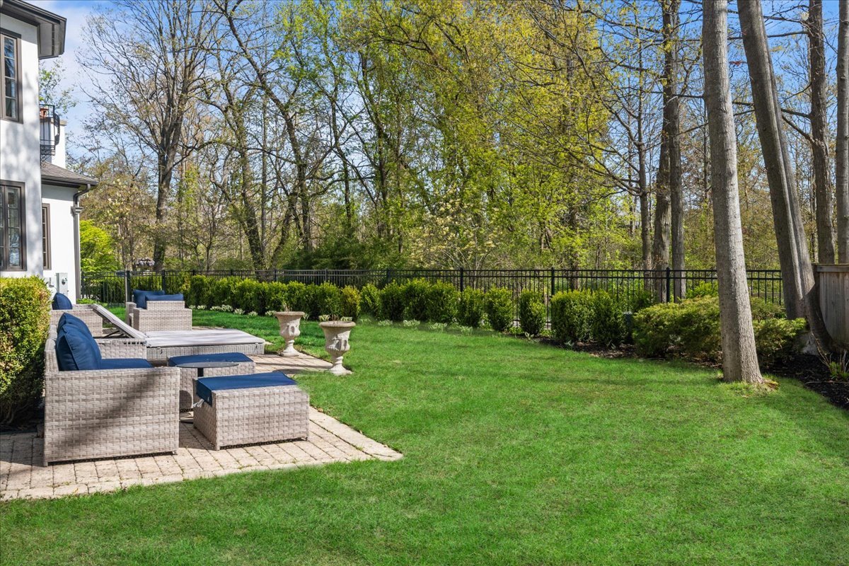 697 Bluff Road Lake Bluff, IL 60044 - Photo 41 of 49 a view of a patio with table and chairs potted plants and large tree