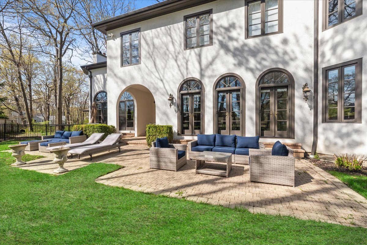 697 Bluff Road Lake Bluff, IL 60044 - Photo 42 of 49 a front view of a house with garden and sitting area