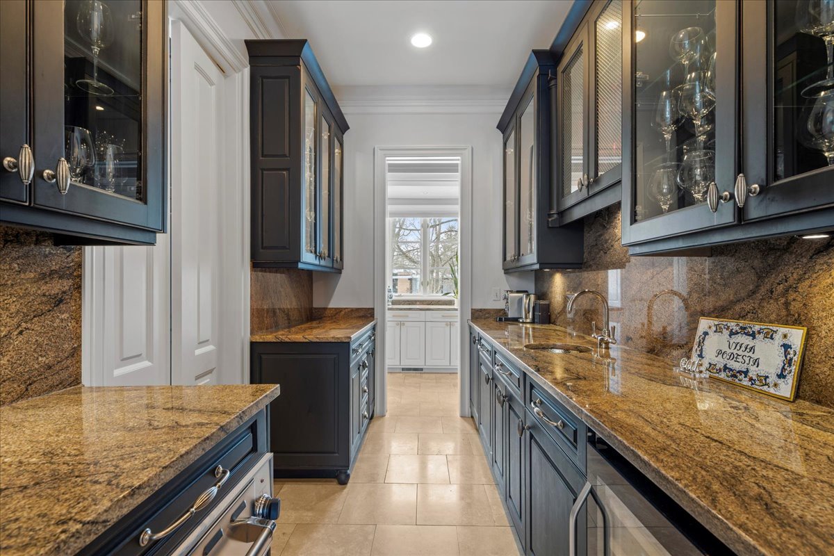 697 Bluff Road Lake Bluff, IL 60044 - Photo 9 of 49 a kitchen with stainless steel appliances granite countertop a sink stove and refrigerator