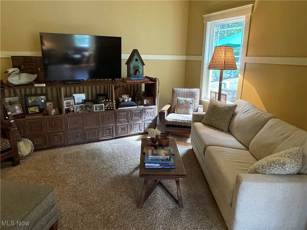 8322 Forest Ridge Street Northwest Massillon, OH 44646 - Photo 22 of 33 Living area with carpet floors