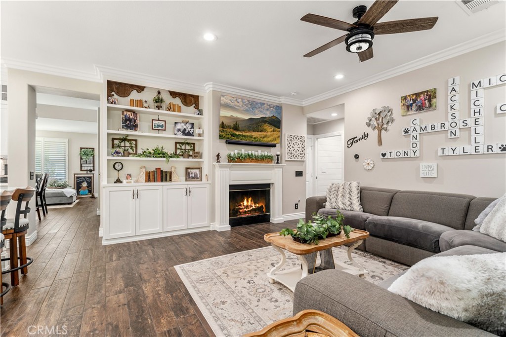 8750 East Heatherwood Road Anaheim Hills, CA 92808 - Photo 15 of 60 a living room with furniture fireplace and window