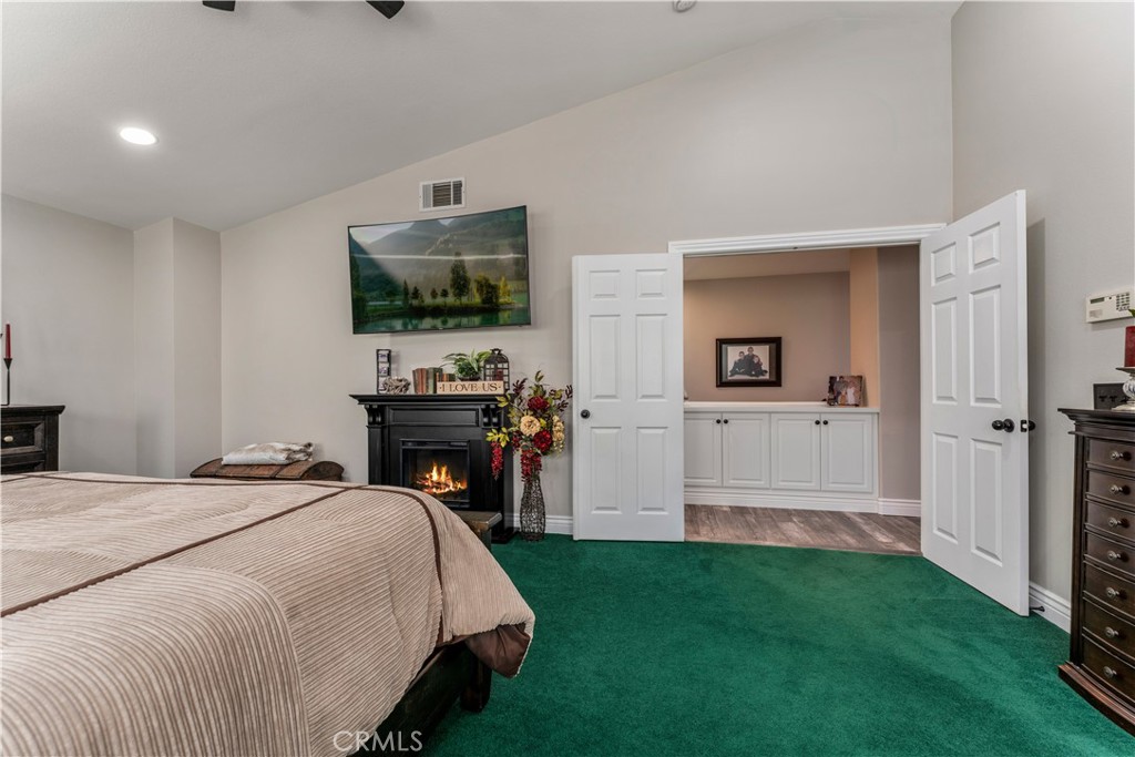 8750 East Heatherwood Road Anaheim Hills, CA 92808 - Photo 24 of 60 a bedroom with a bed and a flat screen tv