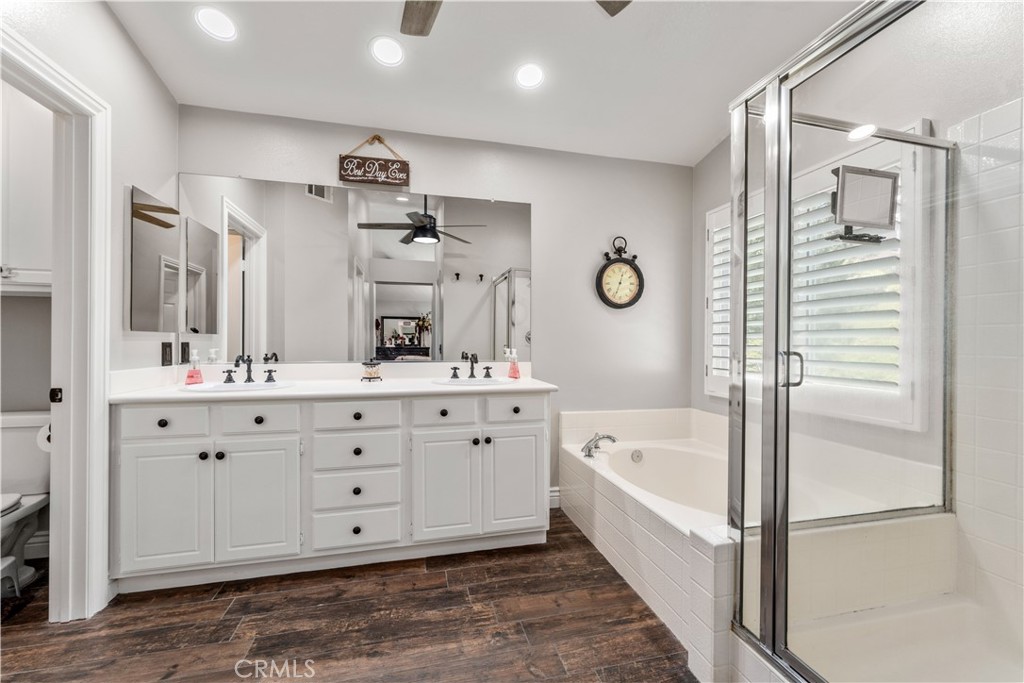 8750 East Heatherwood Road Anaheim Hills, CA 92808 - Photo 27 of 60 a bathroom with a double vanity sink mirror and bathtub