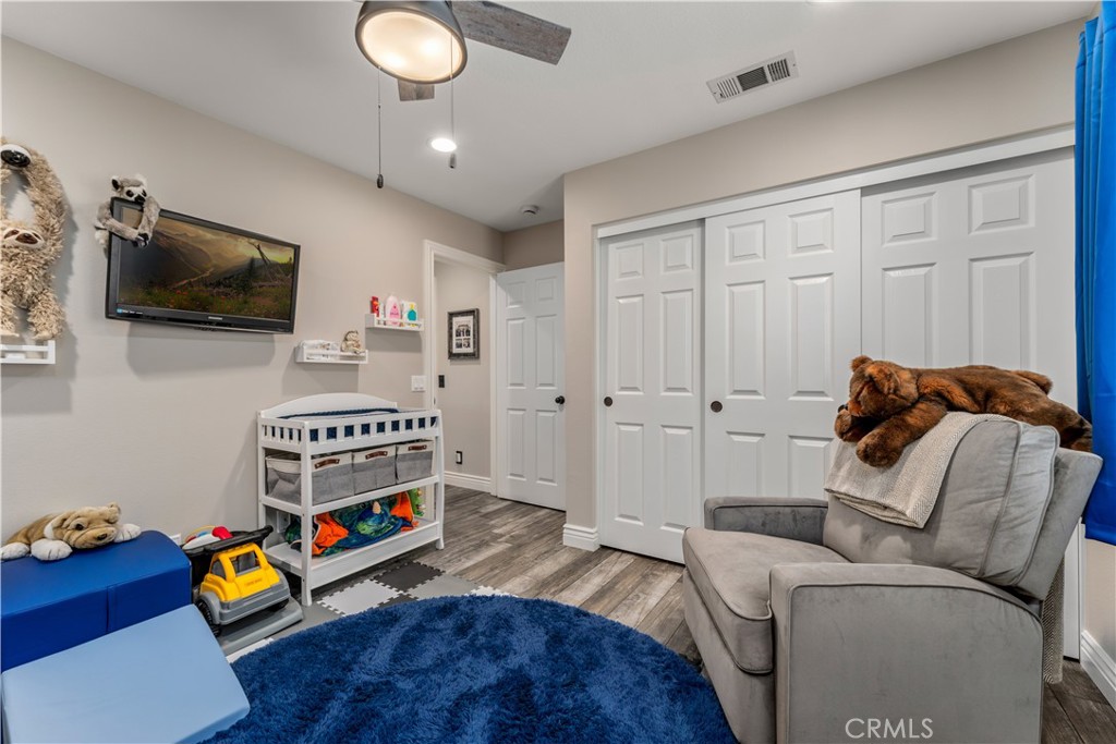 8750 East Heatherwood Road Anaheim Hills, CA 92808 - Photo 33 of 60 a living room with furniture and a flat screen tv