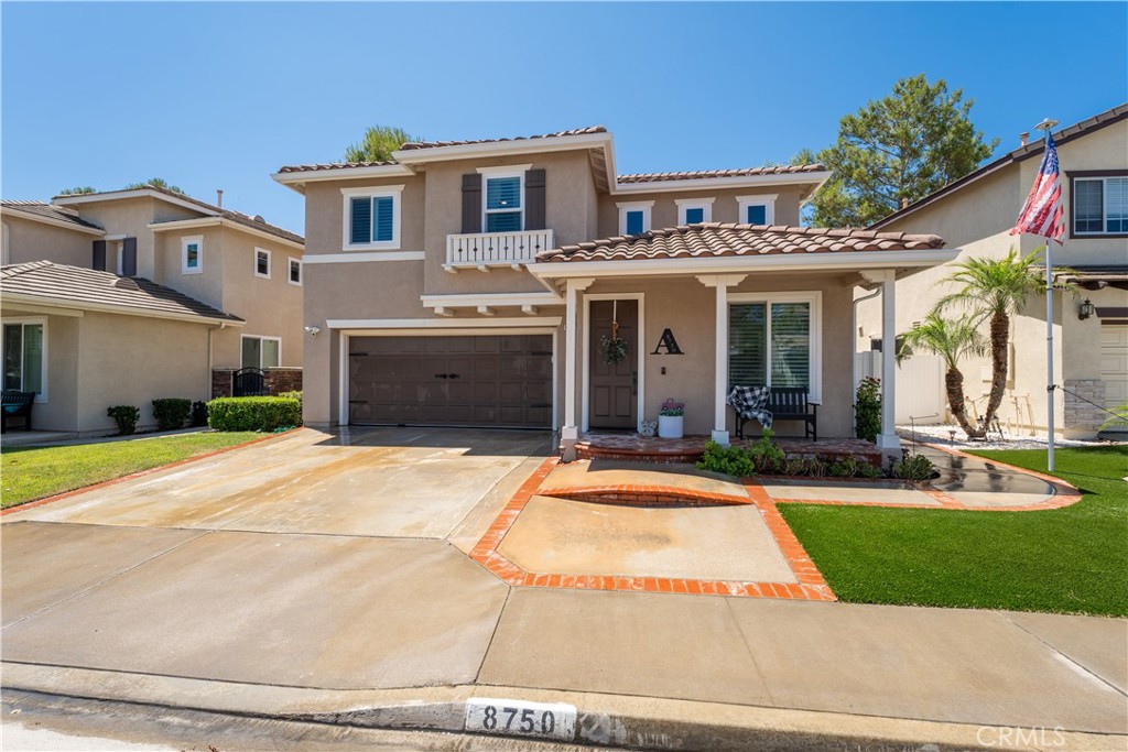 8750 East Heatherwood Road Anaheim Hills, CA 92808 - Photo 48 of 60 a front view of a house with a yard