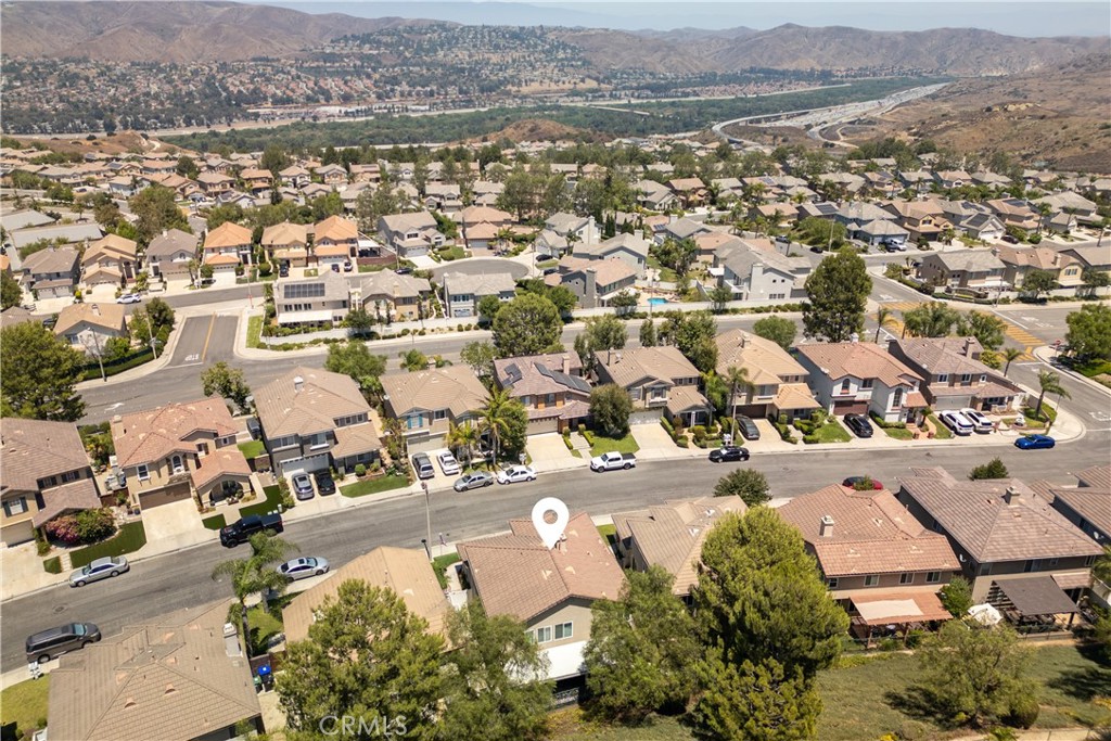 8750 East Heatherwood Road Anaheim Hills, CA 92808 - Photo 50 of 60 an aerial view of residential building with parking