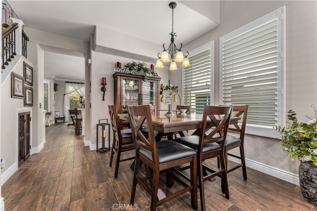 8750 East Heatherwood Road Anaheim Hills, CA 92808 - Photo 6 of 60 a view of a dining room with furniture window and wooden floor