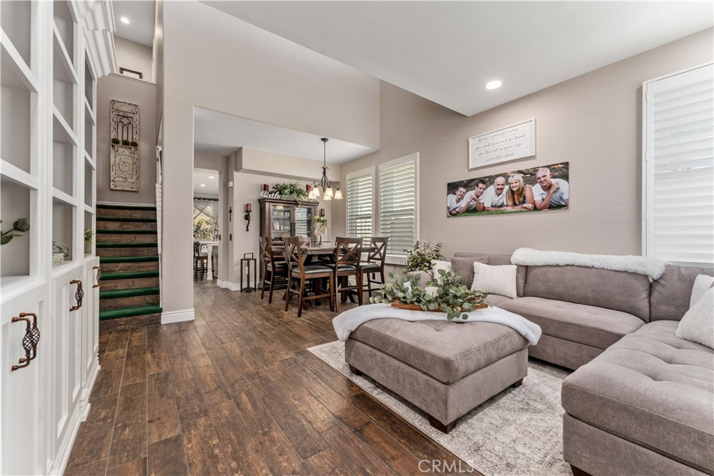 8750 East Heatherwood Road Anaheim Hills, CA 92808 - Photo 7 of 60 a living room with furniture and wooden floor
