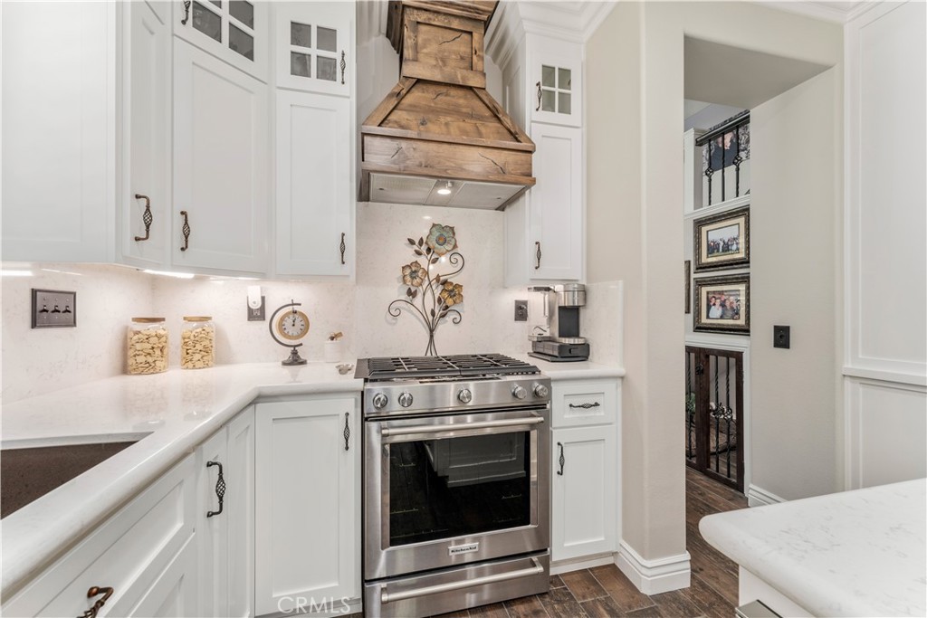 8750 East Heatherwood Road Anaheim Hills, CA 92808 - Photo 10 of 60 a kitchen with stainless steel appliances granite countertop a stove and a sink