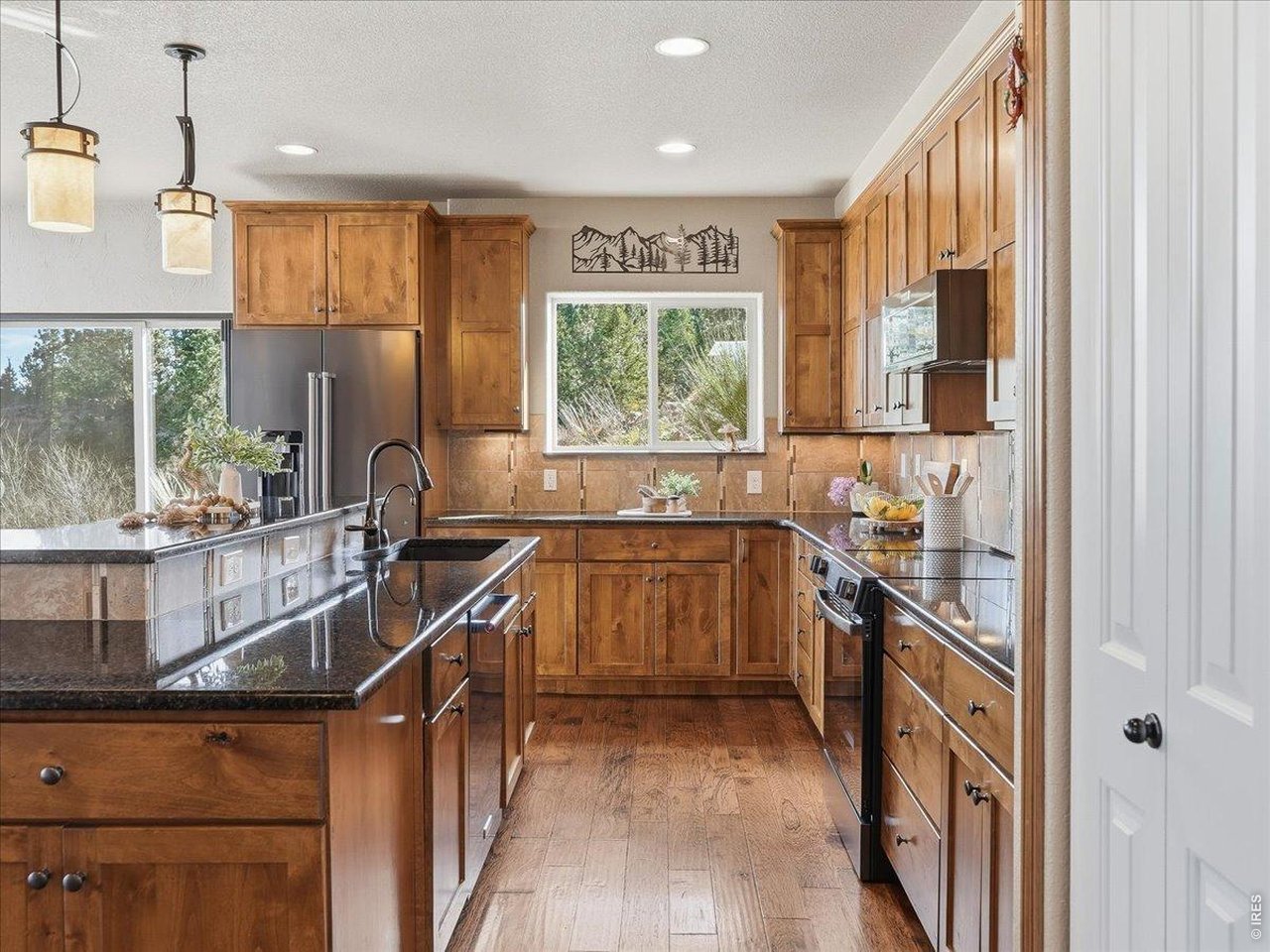 2565 Davis Ranch Road Bellvue, CO 80512 - Photo 15 of 50 Chef Kitchen With Alpine Custom Cabinets and Granite Counters