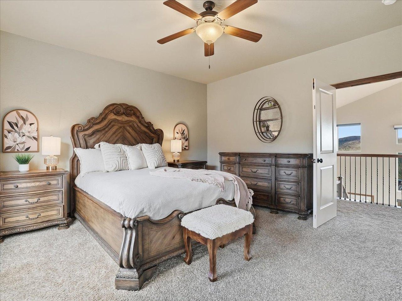 2565 Davis Ranch Road Bellvue, CO 80512 - Photo 31 of 50 Primary Bedroom Overlooks the Living Room With Double Doors and Private Deck
