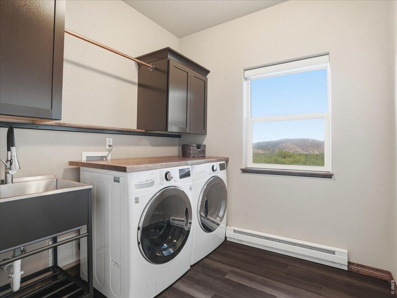 2565 Davis Ranch Road Bellvue, CO 80512 - Photo 38 of 50 Laundry With Wash Sink Conveniently Located Next To Bedrooms On Second Floor