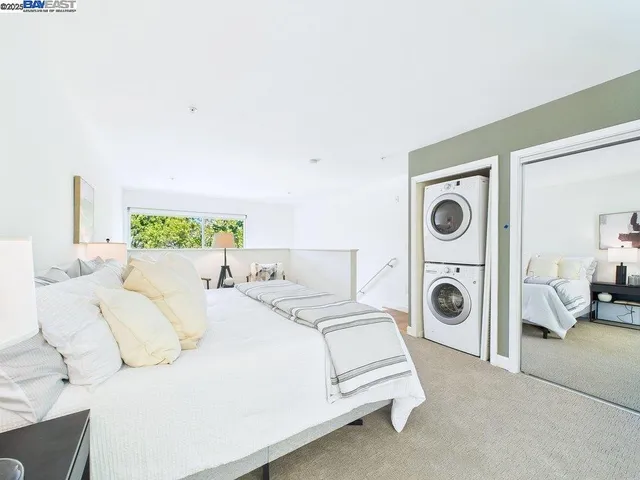 a bed room with a bed and white wall