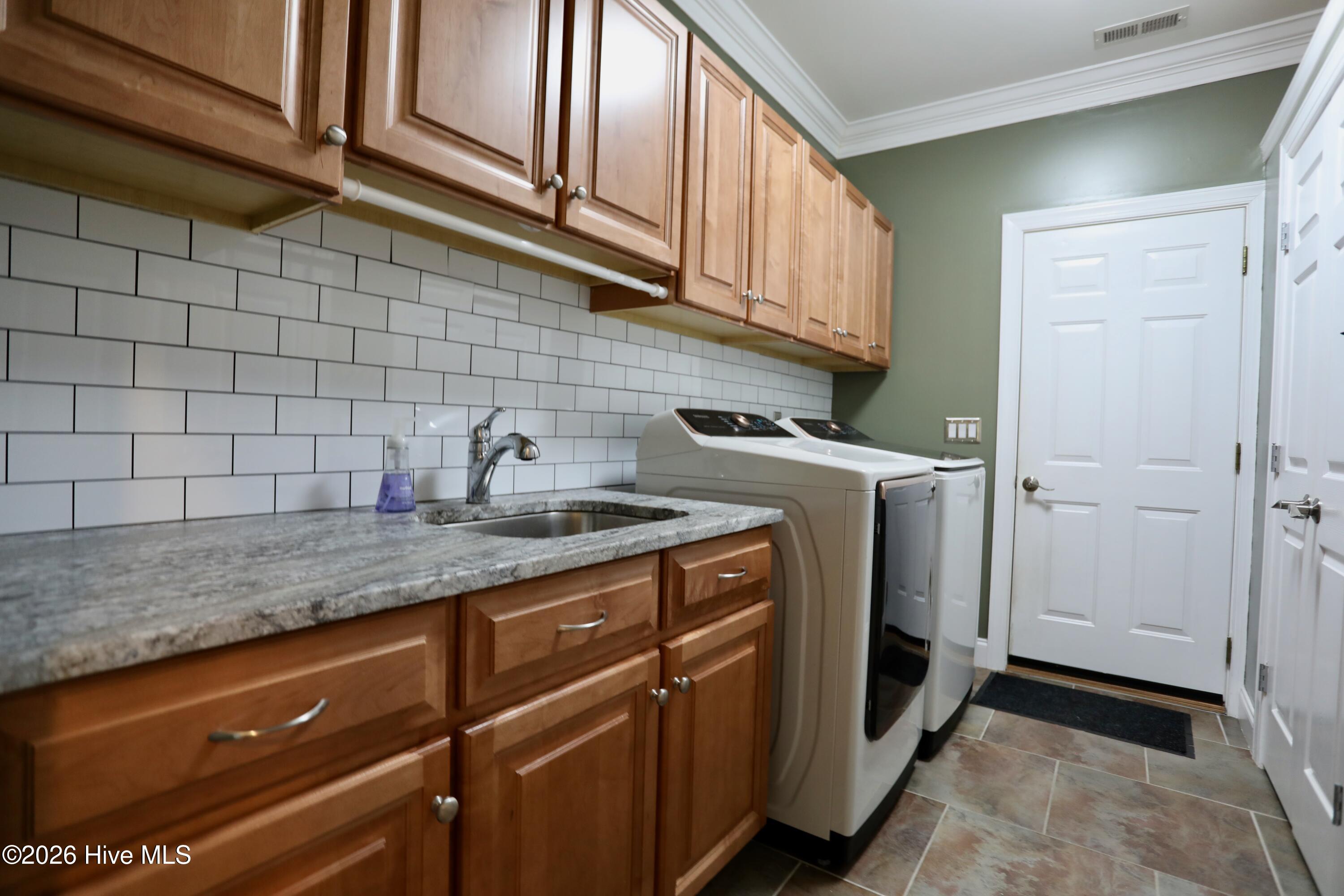 129 Beacon Ridge Drive West End, NC 27376 - Photo 24 of 73 Laundry - New Granite Counters