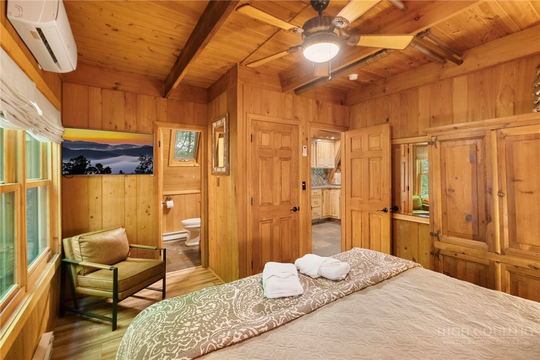 268 Cherry Drive Boone, NC 28607 - Photo 13 of 29 a bedroom with a bed a table and chair