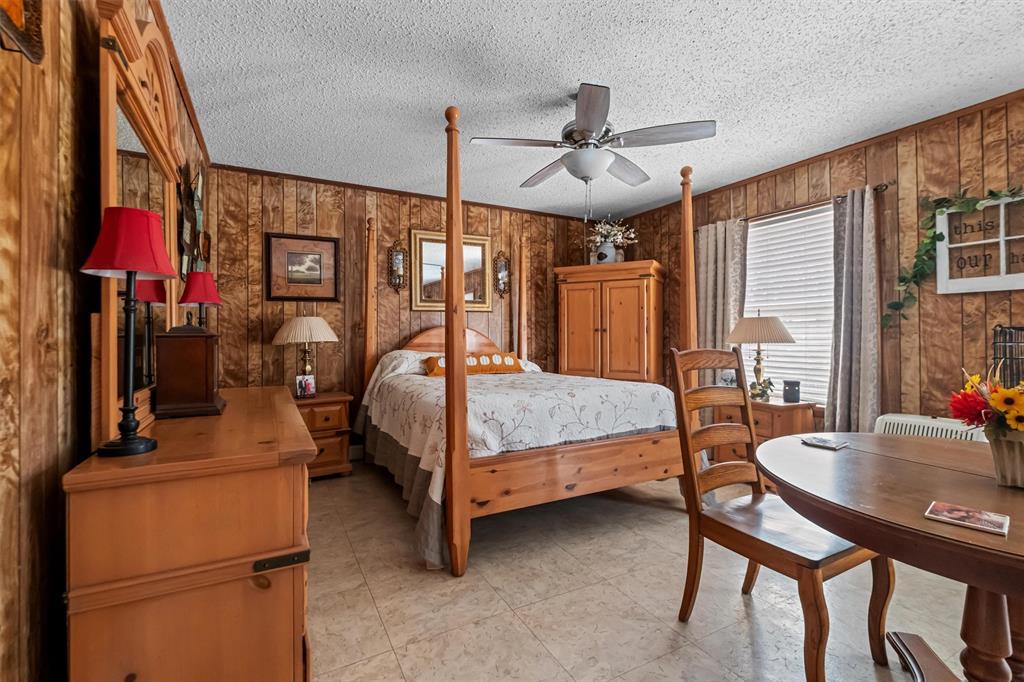 703 Amy Street Canton, TX 75103 - Photo 23 of 32 a bedroom with a bed and a table