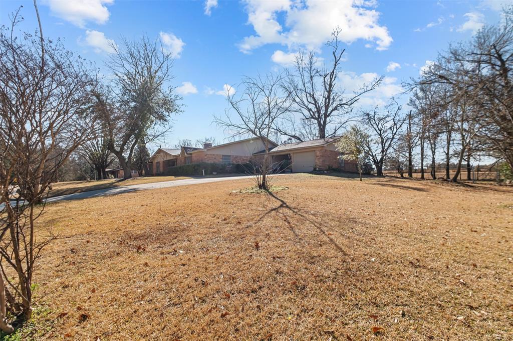 703 Amy Street Canton, TX 75103 - Photo 4 of 32 a street view covered with snow