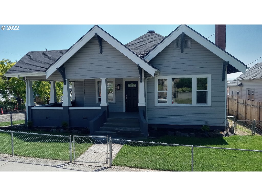324 Northwest 9th Street Pendleton, OR 97801 - Photo 1 of 24 a front view of a house with a yard