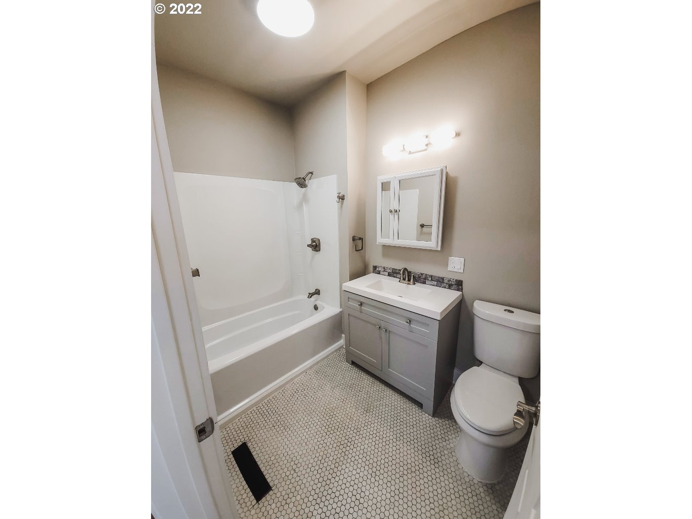 324 Northwest 9th Street Pendleton, OR 97801 - Photo 17 of 24 a bathroom with a bathtub sink mirror vanity and toilet