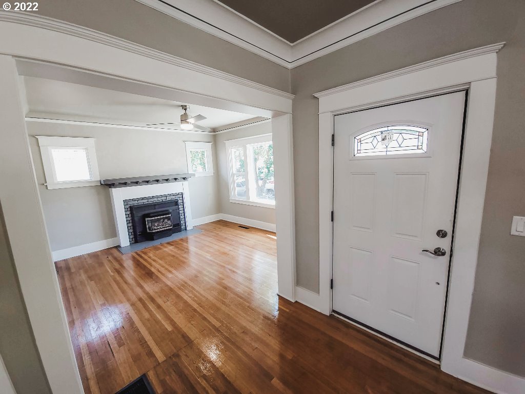 324 Northwest 9th Street Pendleton, OR 97801 - Photo 10 of 24 a view of empty room with wooden floor and fireplace