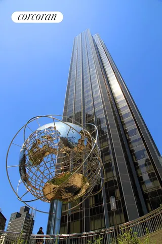 a view of a building with a umbrellas on the street