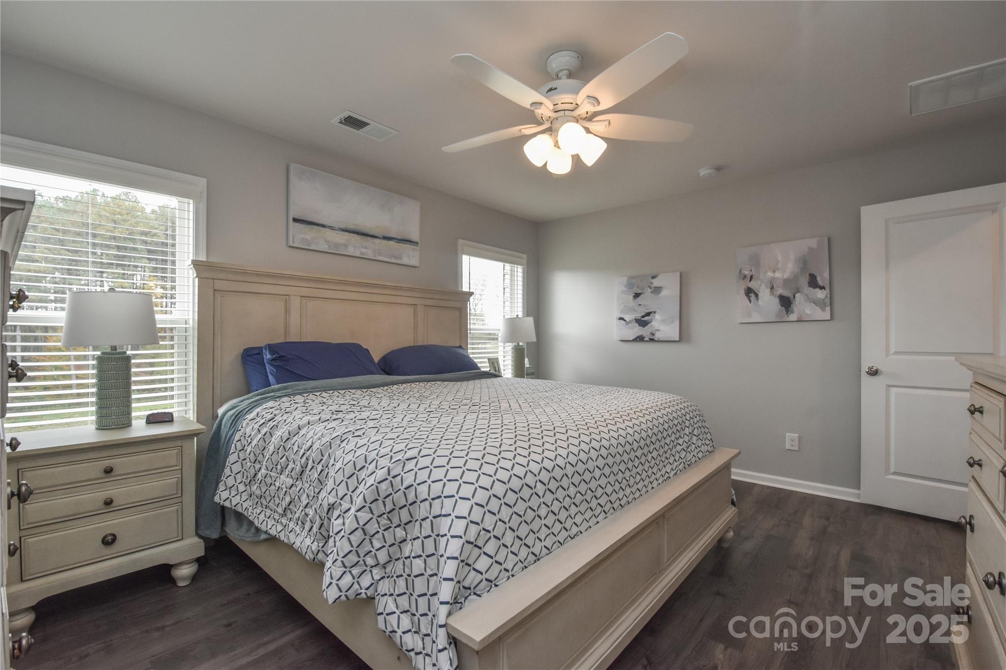 8097 Sheffield Dr. Drive Terrell, NC 28682 - Photo 11 of 26 a bedroom with a large bed and a chandelier
