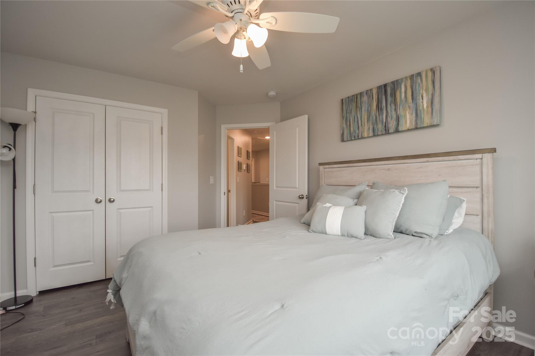 8097 Sheffield Dr. Drive Terrell, NC 28682 - Photo 20 of 26 a bedroom with a large bed and a chandelier