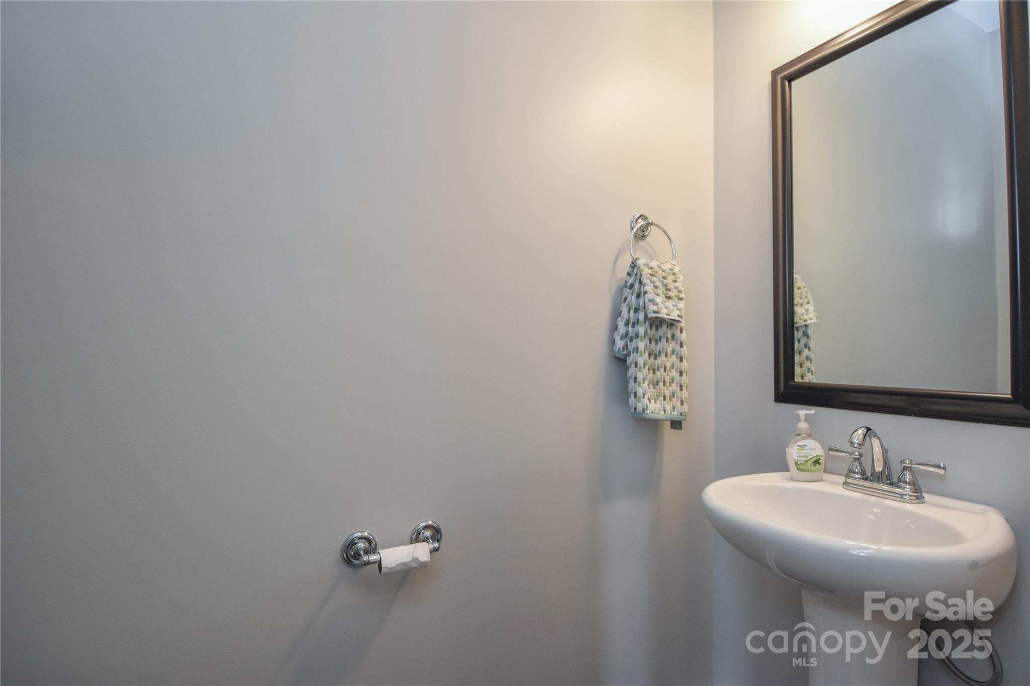 8097 Sheffield Dr. Drive Terrell, NC 28682 - Photo 23 of 26 a bathroom with a sink a mirror and vanity