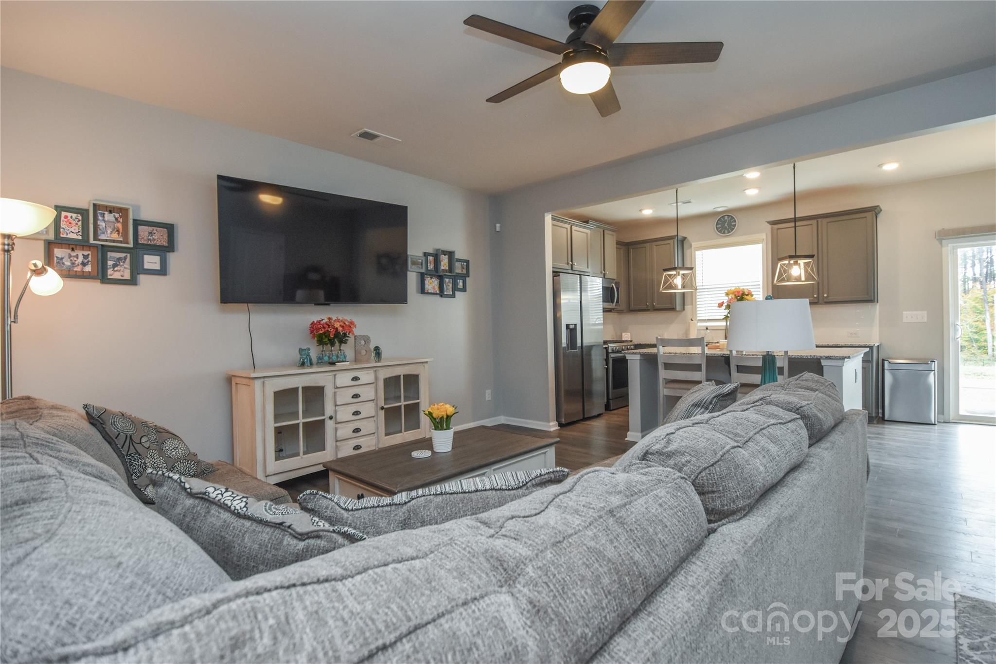 8097 Sheffield Dr. Drive Terrell, NC 28682 - Photo 7 of 26 a living room with furniture and a flat screen tv
