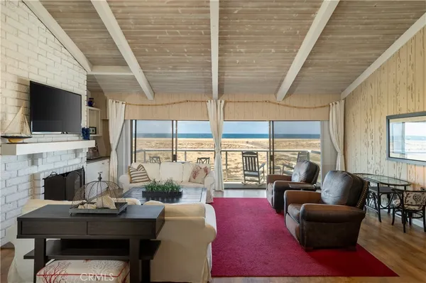 a living room with fireplace furniture and a flat screen tv