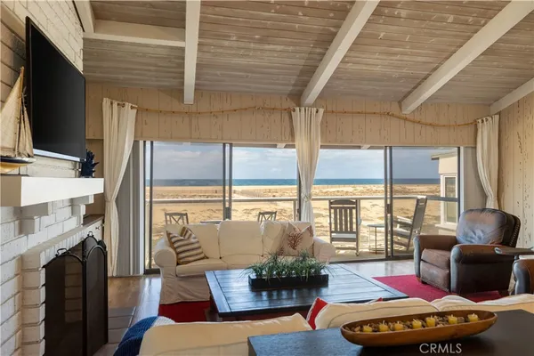 an aerial view of a balcony with a table and chairs
