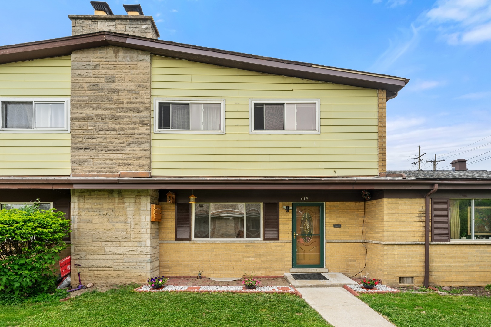 419 Glenshire Road Glenview, IL 60025 - Photo 1 of 11 a view of a house with a yard and potted plants