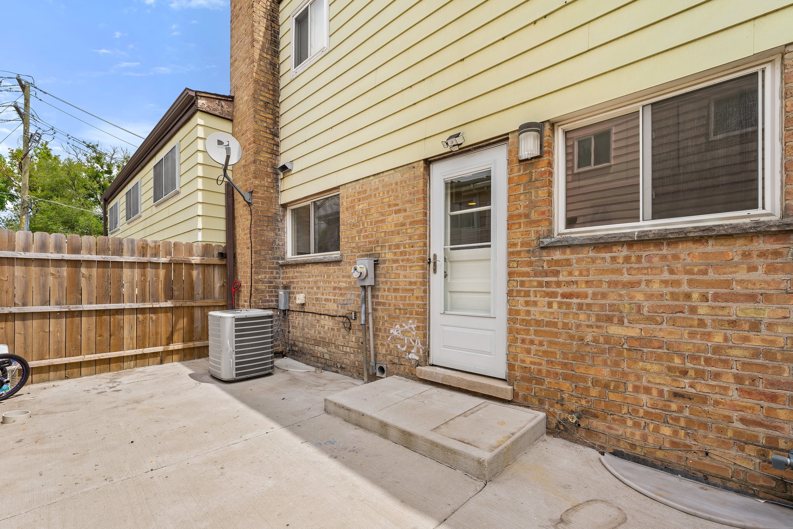419 Glenshire Road Glenview, IL 60025 - Photo 11 of 11 a backyard of a house with barbeque oven and wooden fence