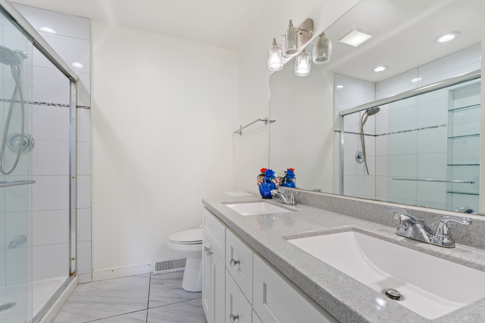 419 Glenshire Road Glenview, IL 60025 - Photo 8 of 11 a bathroom with a granite countertop sink a toilet and a mirror