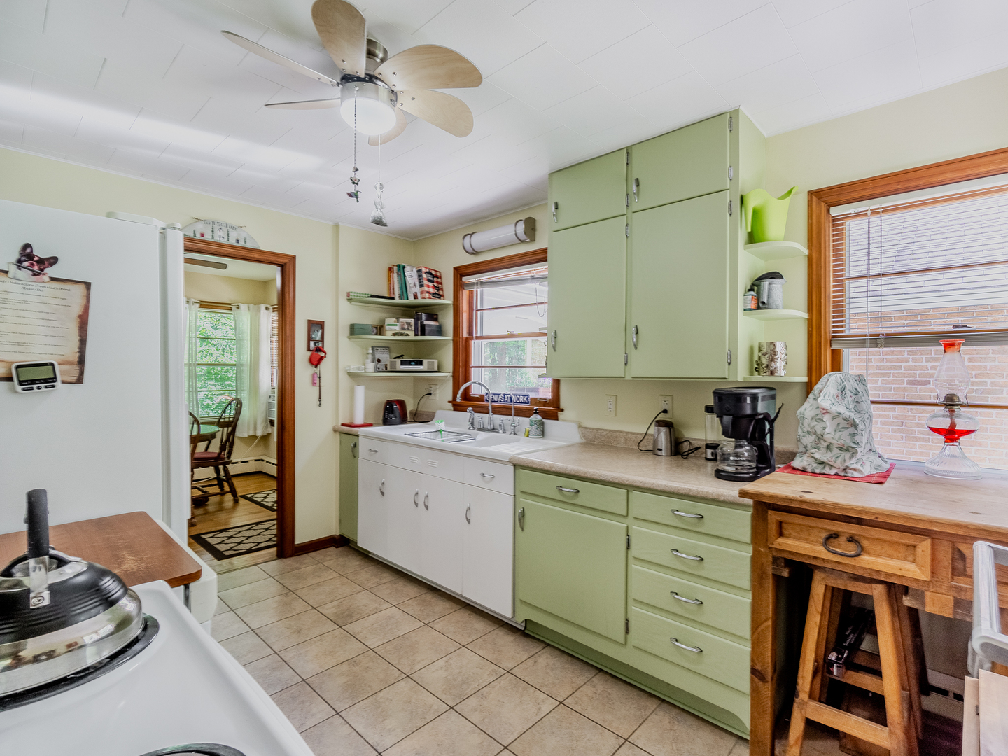 5415 West Pauling Road Monee, IL 60449 - Photo 13 of 17 a kitchen that has a lot of cabinets in it and wooden floors