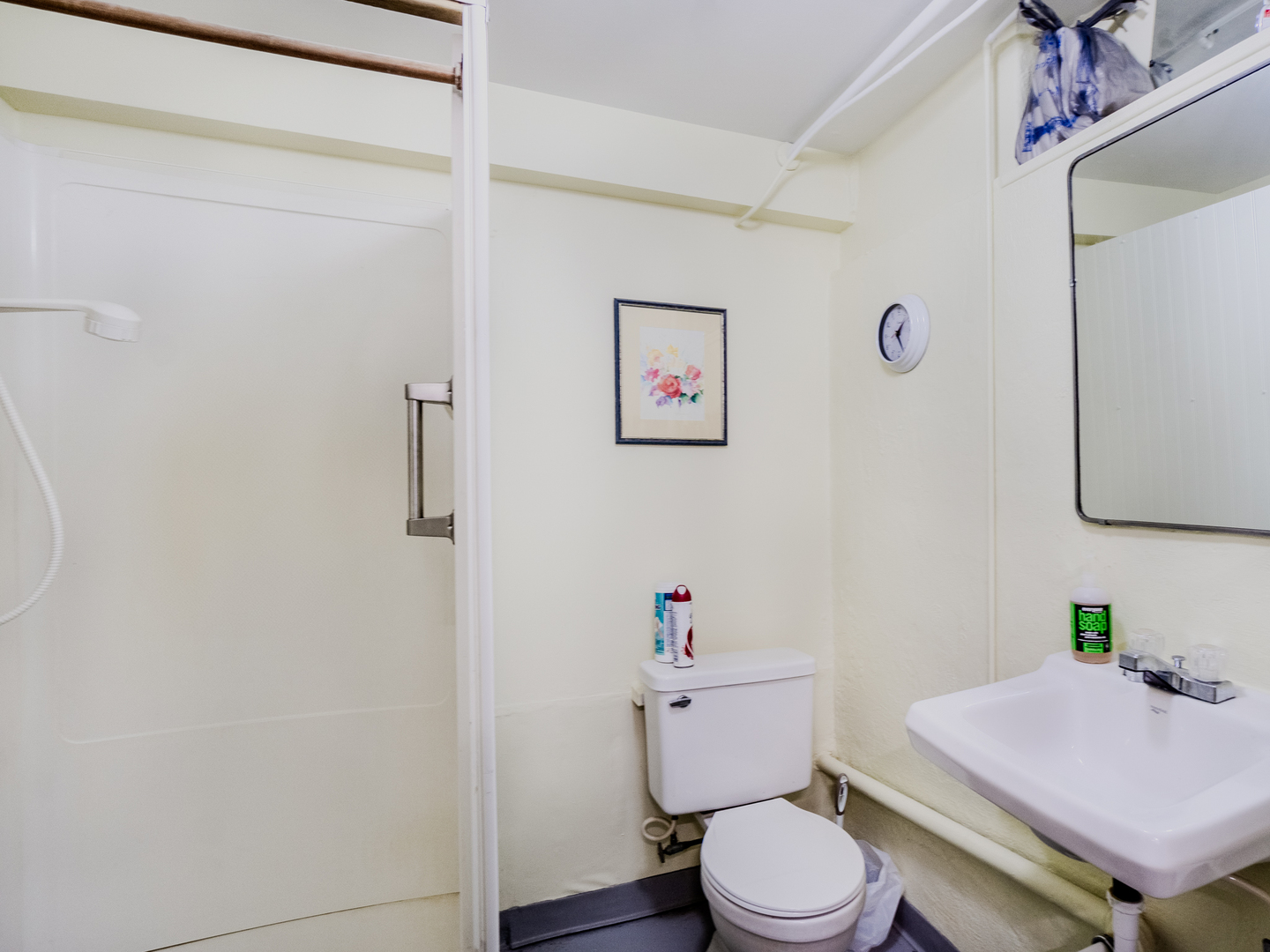 5415 West Pauling Road Monee, IL 60449 - Photo 14 of 17 a white toilet sitting next to a bathroom sink